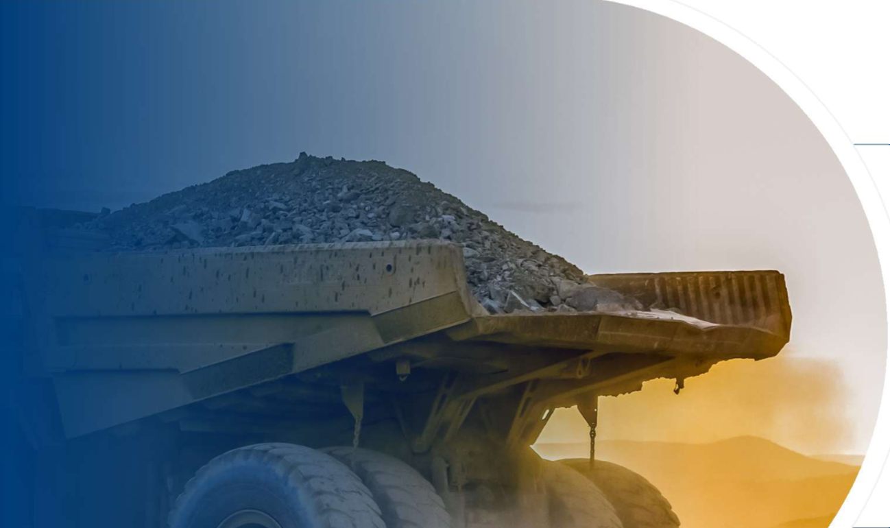 Heavy dumper hauling rock